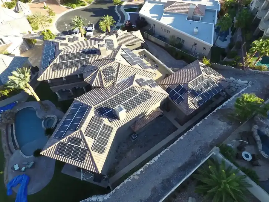 Nevada suburban home with rooftop solar panels under intense desert sun near Las Vegas